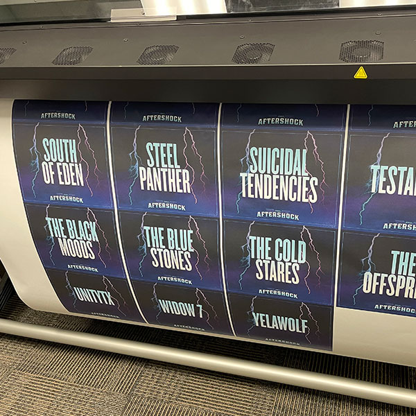Large-format inkjet printer producing Aftershock festival poster prints