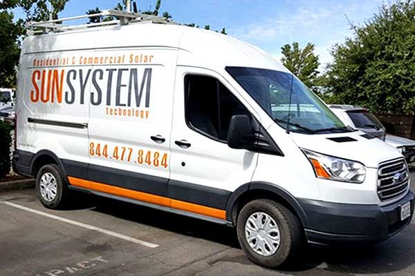 SunSystem Technology cargo van with cut vinyl decals and orange accent stripe
